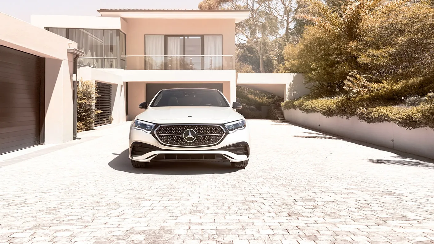 White Mercedes-Benz E-Class in driveway